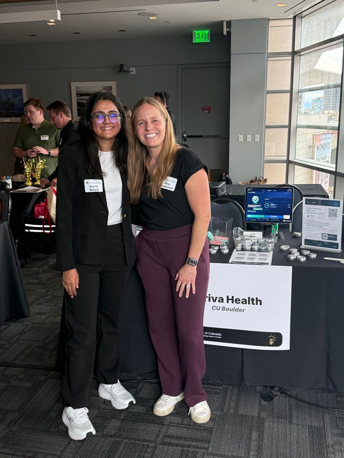 Sukriti Sehgal with a friend from the University of Colorado at the booth